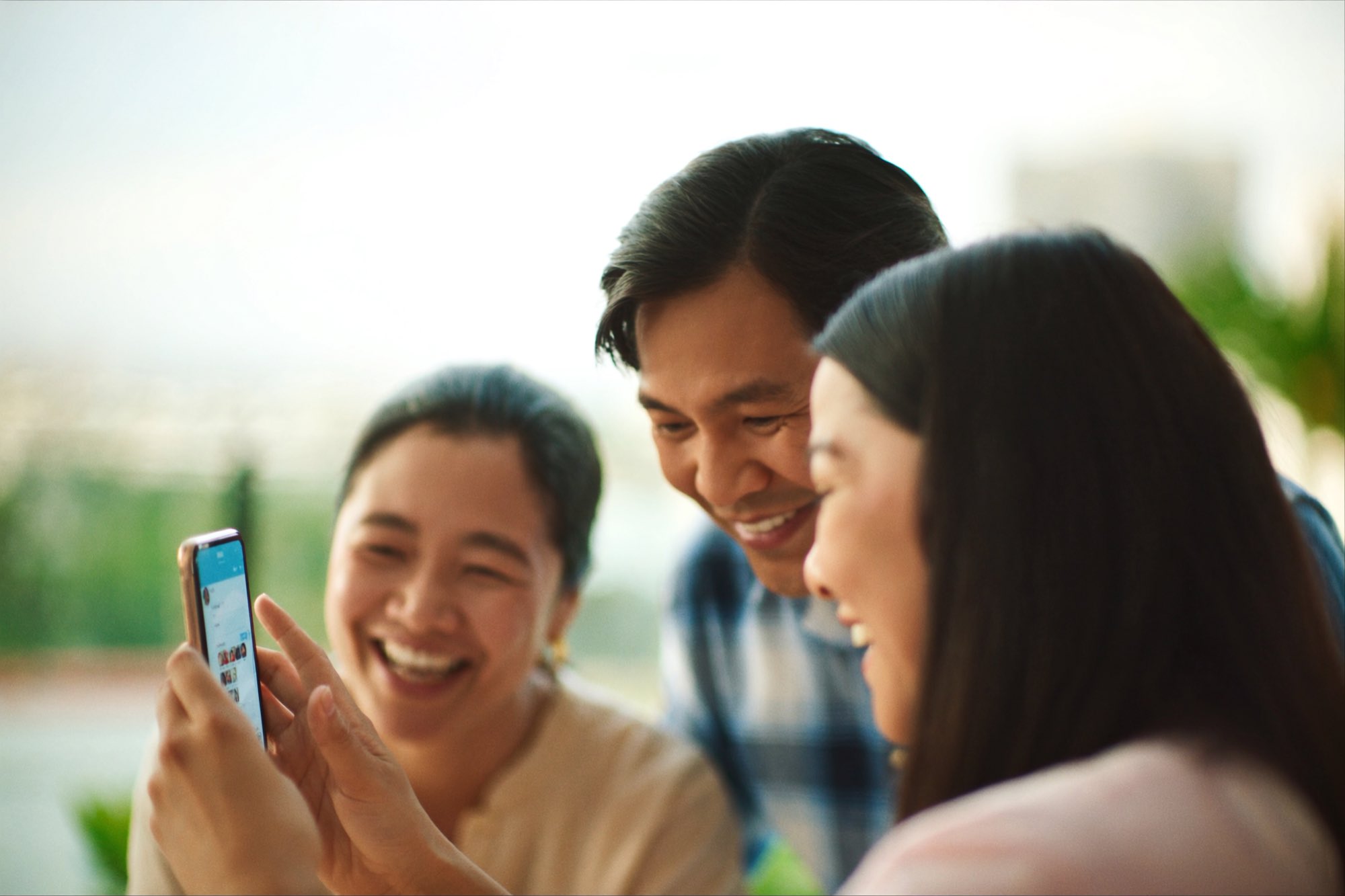 Solstice residents catching up on the community group chat on their phones